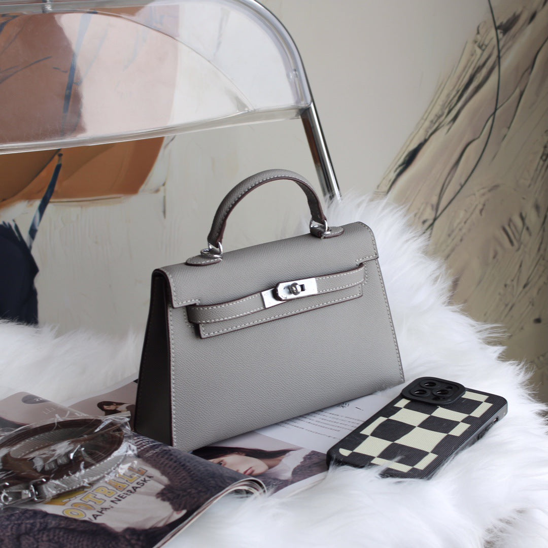 A fashionable women's handbag with a one-shoulder crossbody strap