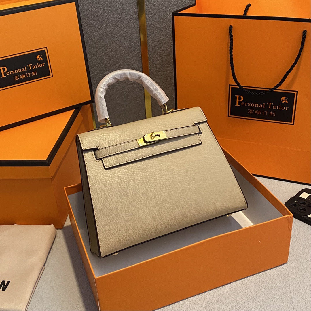 A fashionable women's handbag with a one-shoulder crossbody strap