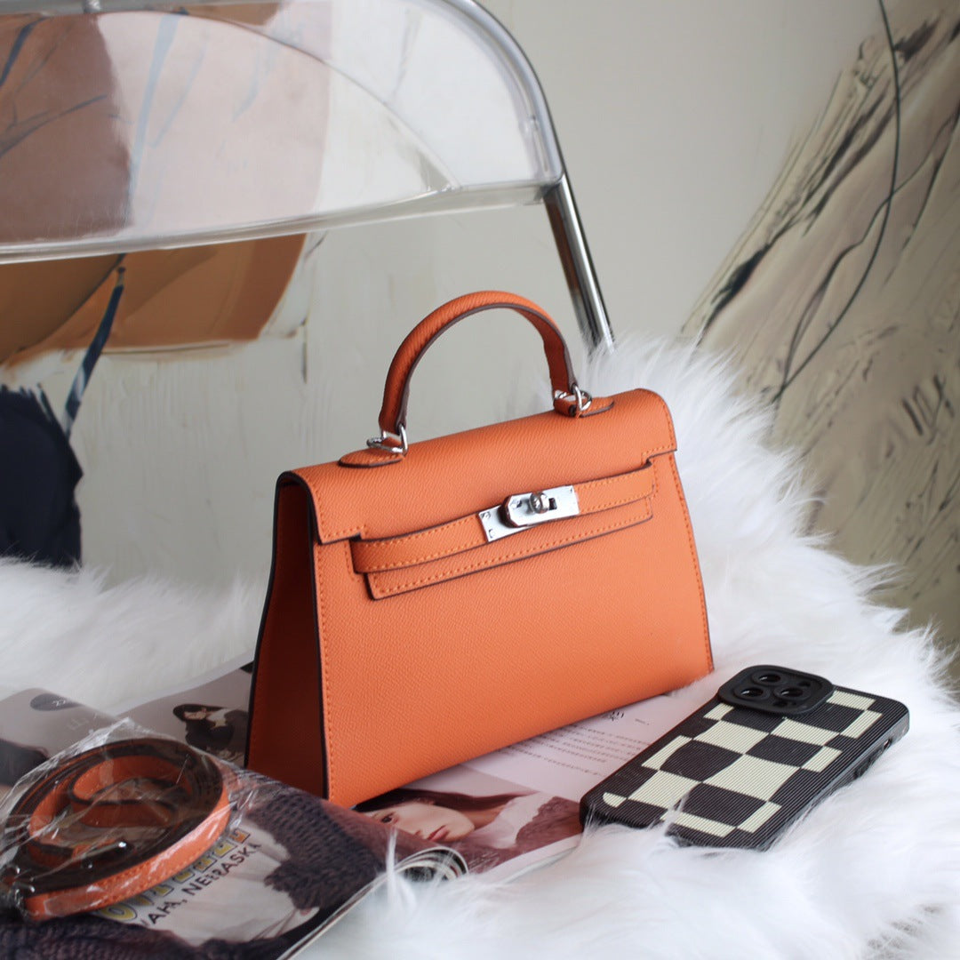 A fashionable women's handbag with a one-shoulder crossbody strap