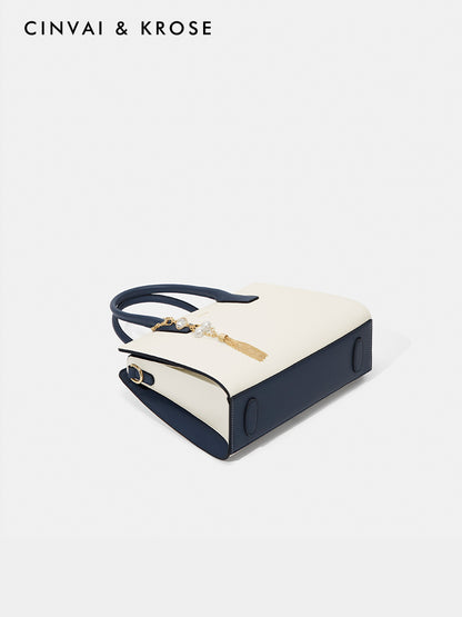 Hand-held shoulder-sling bag